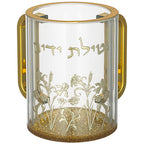 נטלה מהודרת מאקריליק שקוף בגובה 13 ס"מ, עם שתי ידיות מוזהבות, בסיס מוזהב ומנצנץ, וכיתוב בולט בזהב של המילים "נטילת ידיים". החלק התחתון של הנטלה מעוטר באיורי פרחים וענפים בזהב.